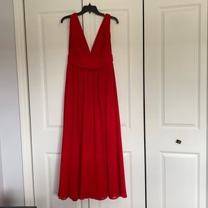 Floor length red gown.